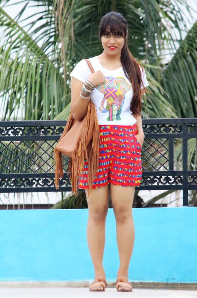 Shrizan Wearing White Tee And Red Printed Shorts